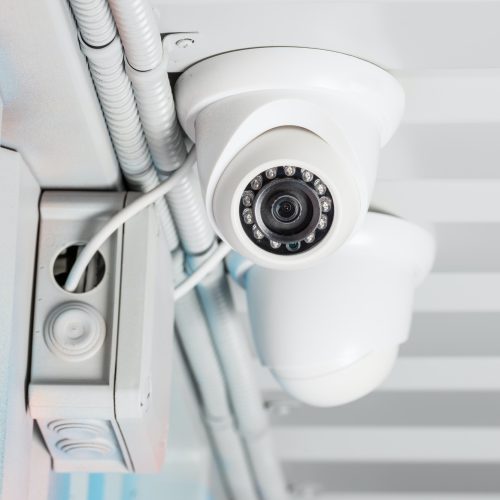 white-security-camera-on-ceiling-home-security-system-concept